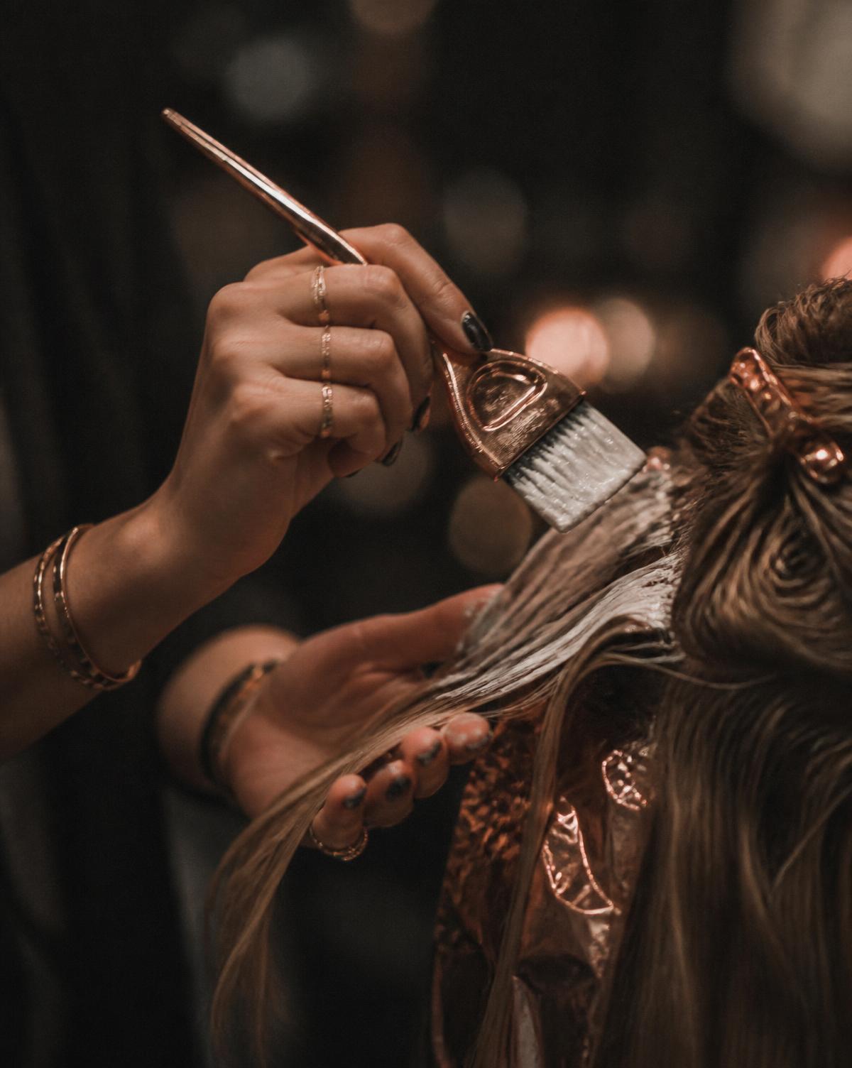 Hand-painted balayage application in progress